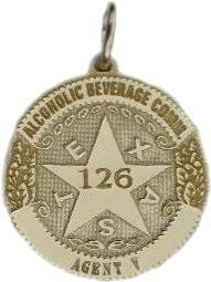 14k yellow gold custom mini-badge jewelry pendant; round badge with 5 pt 5 point five point star center in design of Texas Alcoholic Beverage Commission; also available as tie tac, lapel pin, cuff links