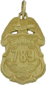 gold plated sterling silver custom mini-badge jewelry pendant; eagle top badge design of Galveston Police Department; also available as tie tac, lapel pin, or cuff links