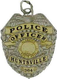 two tone sterling silver custom mini-badge jewelry pendant; eagle top badge design of Huntsville Police Officer with gold plated highlights