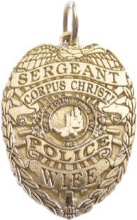 14k yellow gold mini-badge jewelry pendant; eagle top badge design of Corpus Christi Police Department; also available as a tie tac, lapel pin, or cuff links