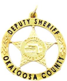 Gold plated sterling silver custom mini-badge jewelry pendant; five point star with circle design of Okaloosa County Sheriff Deputy badge; also available as mini-badge tie tac, lapel pin, cuff links