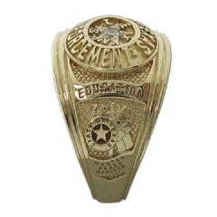 Our Texas Law Enforcement class-style ring shown in 14k yellow gold with center set gemstone.