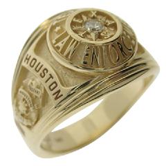 A custom Houston Police Sergeant's professional ring in 14k yellow gold with a 0.08 ct. round brilliant diamond.