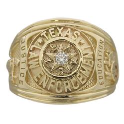 Our Texas Law Enforcement class-style ring shown in 14k yellow gold with center set gemstone.